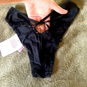 NWT, savage X Fenty, black high cut briefs with cut out detail in the back Sz XS